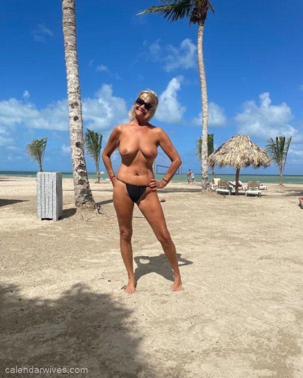 Beautiful blonde wife topless beach